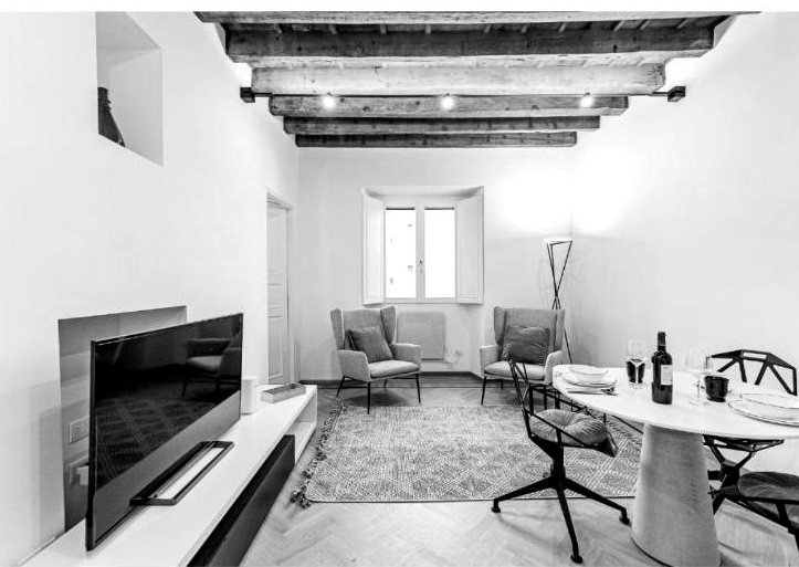 Casa Asnago e Vender — soggiorno con TV e tavolo da pranzo